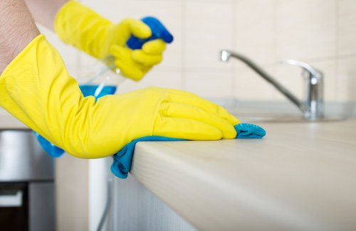 Professional carpet cleaners following safety procedures